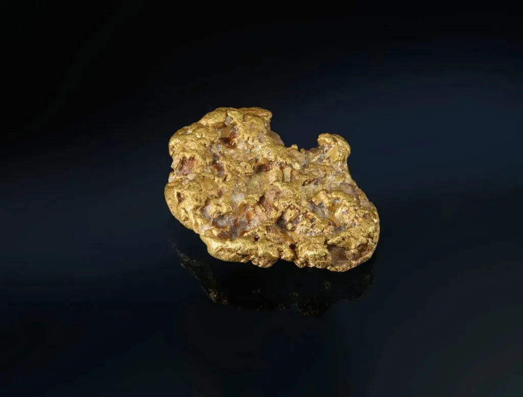 gold nugget on dark background