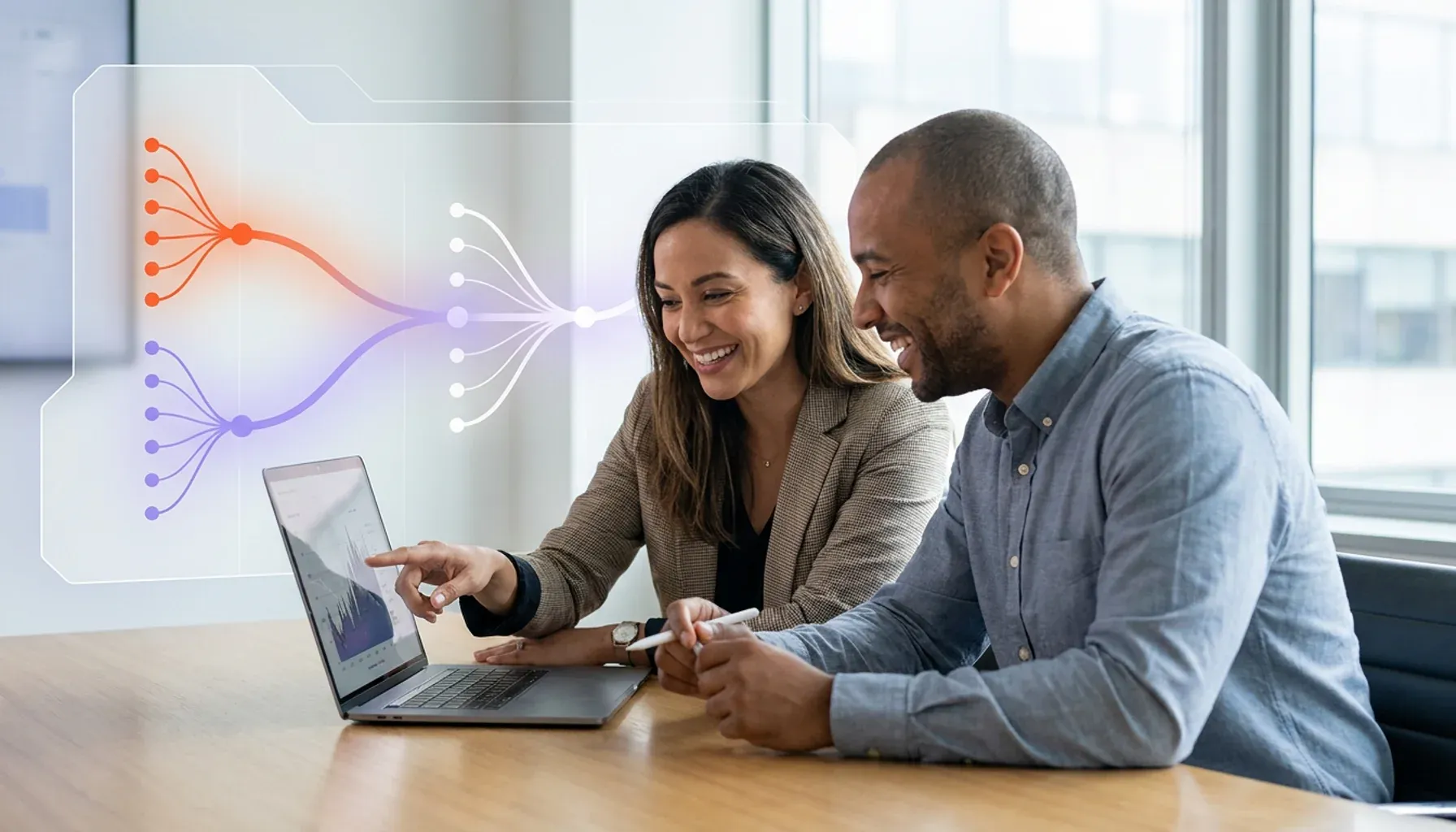 Two smiling colleagues analyzing data on a laptop, with a digital network diagram overlay.