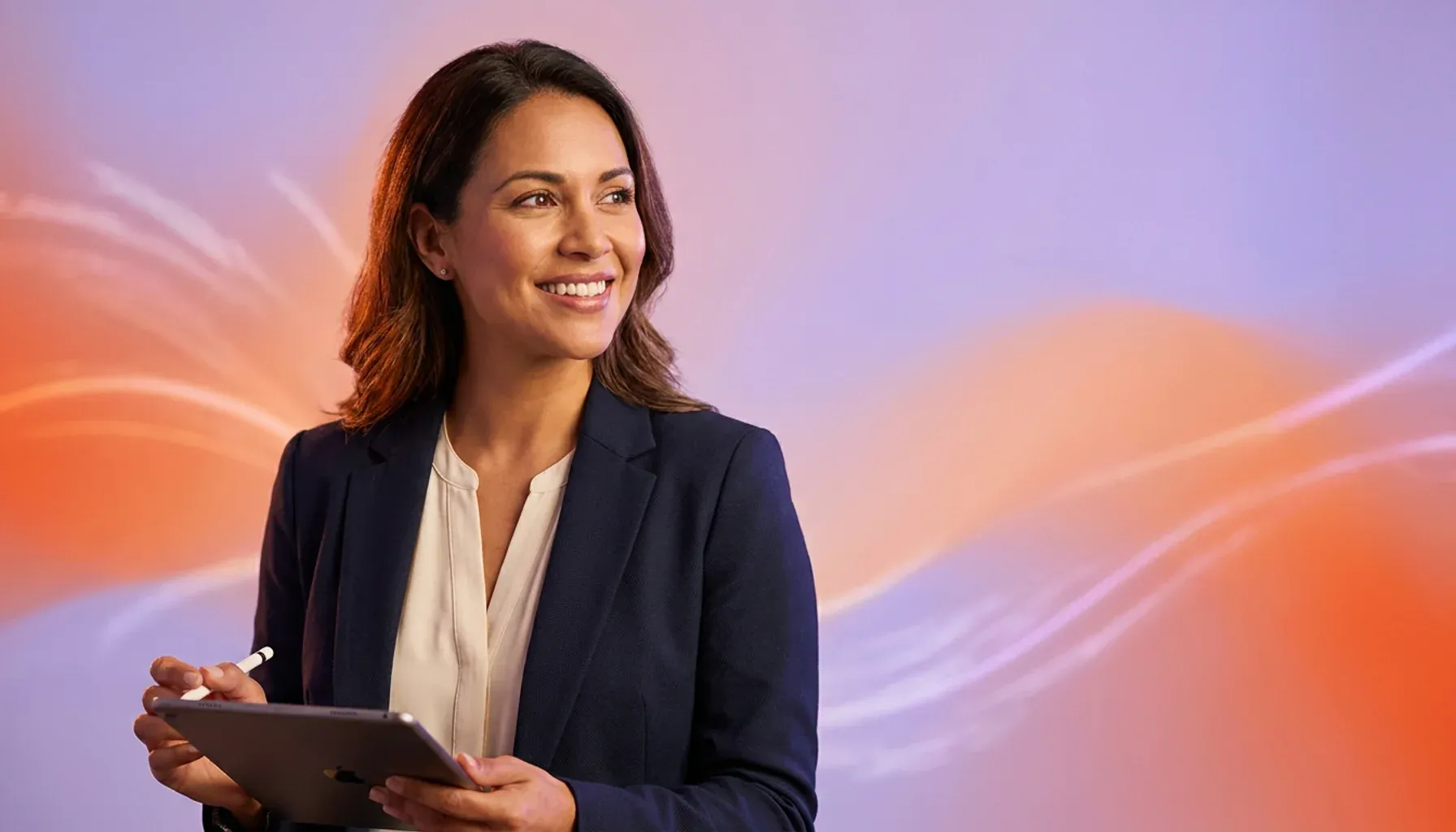 Smiling businesswoman holding a tablet with an Apple logo and a stylus.