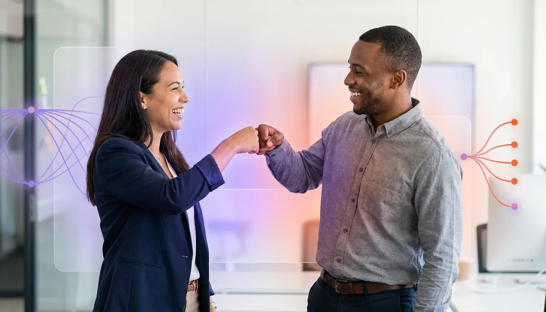 Two smiling colleagues fist-bumping in an office with abstract digital network overlays.
