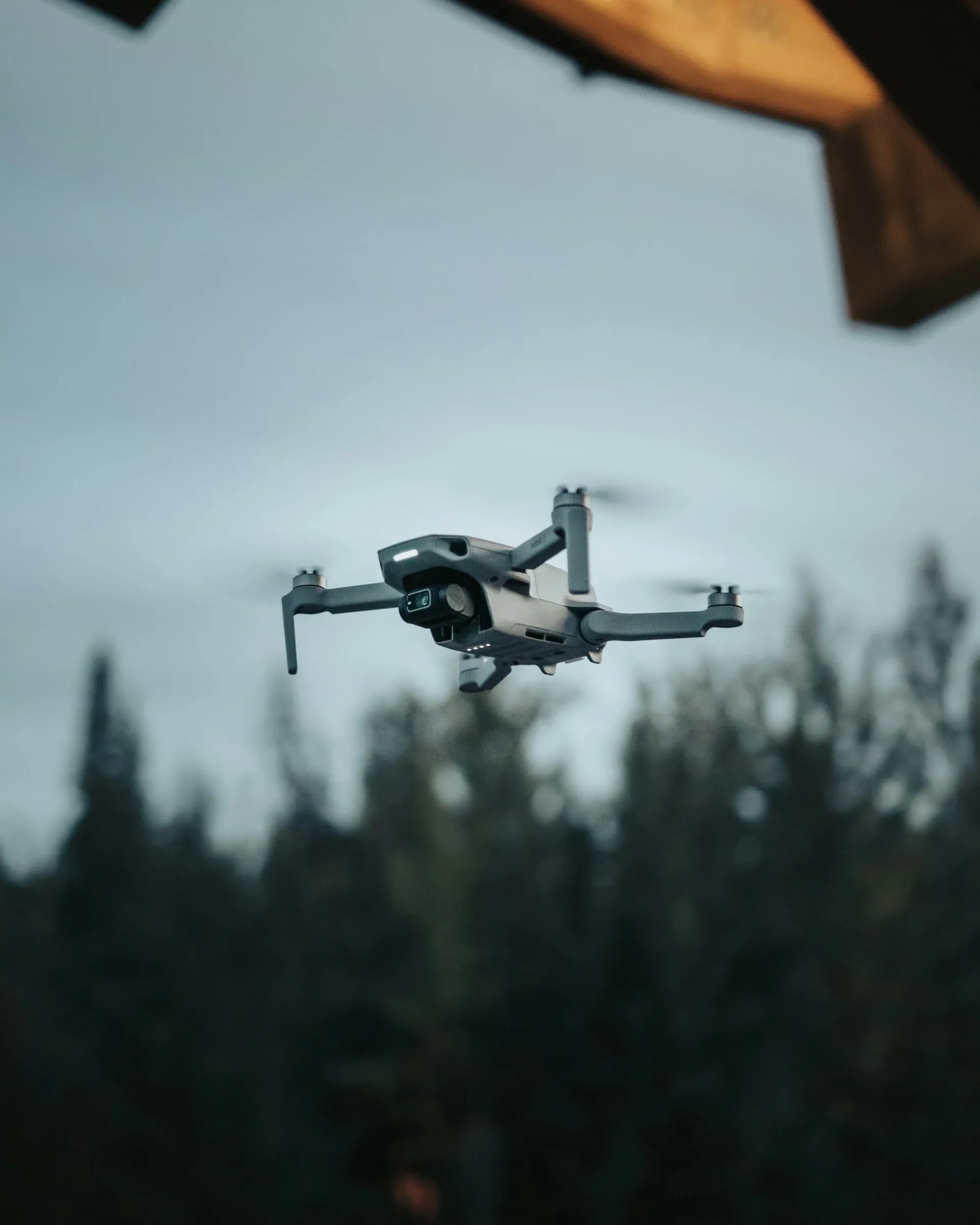 Autonomous drone in flight with a forest in the background